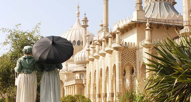 Regency style ladies walking past the Royal Pavilion, Brighton